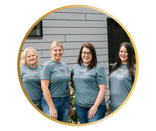Four Wallowa Valley Center for Wellness' employees smiling together